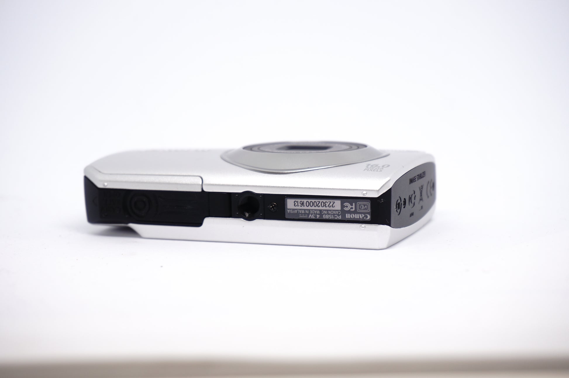 Canon White 5X Zoom Compact Digital Camera underneath view
