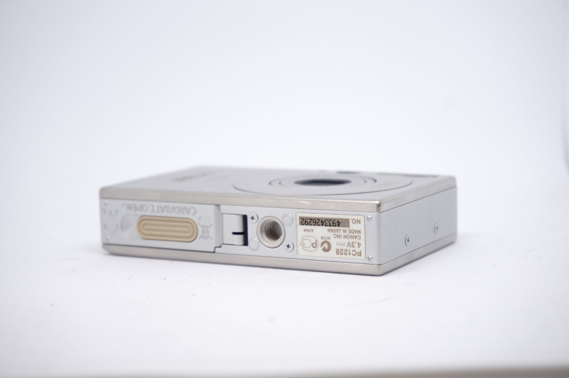 Canon IXUS Silver 7.1MP Compact Digital Camera underneath view