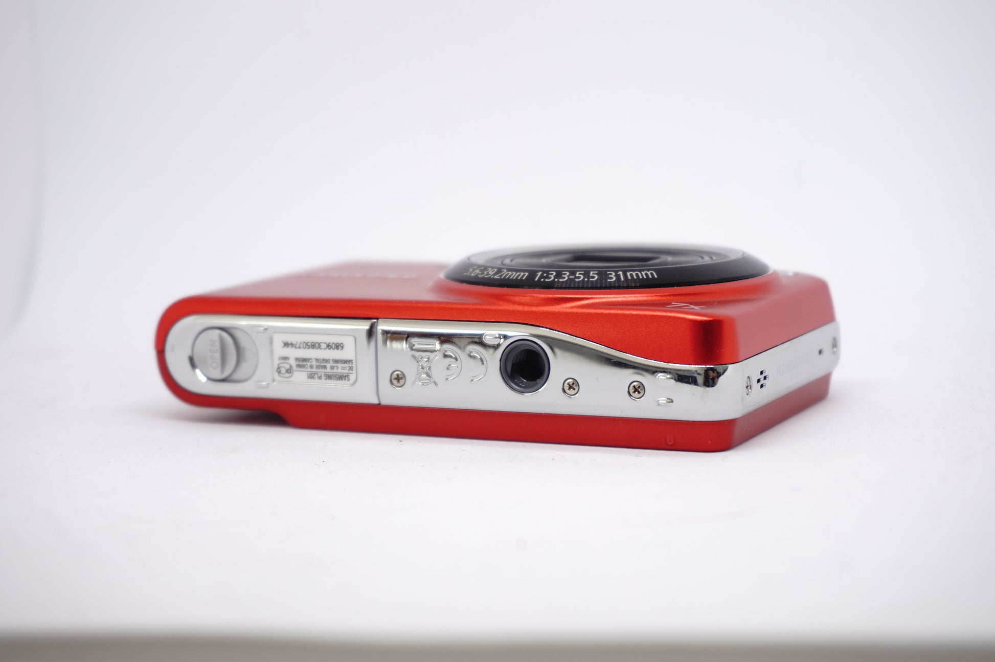 Samsung Red 7x Compact Digital Camera underneath view